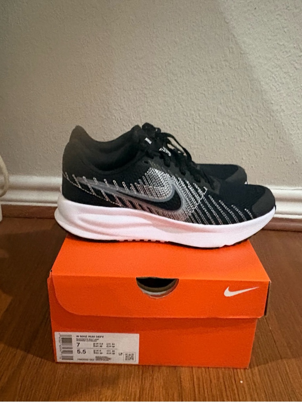 Nike Run Defy Women’s Black and White Athletic Sneakers
